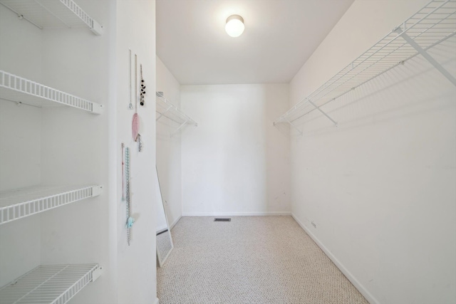 61 Old Carriage Ln, Lapeer, MI 48446 - spacious closet featuring visible vents and carpet flooring