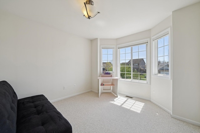 61 Old Carriage Ln, Lapeer, MI 48446 - living area featuring baseboards, visible vents, and carpet