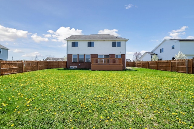 61 Old Carriage Ln, Lapeer, MI 48446 - back of house featuring brick siding, a fenced backyard, and a lawn