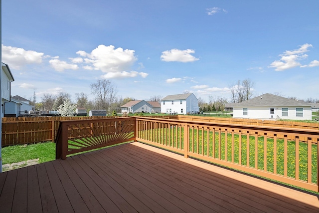 61 Old Carriage Ln, Lapeer, MI 48446 - deck featuring a fenced backyard, a yard, and a residential view