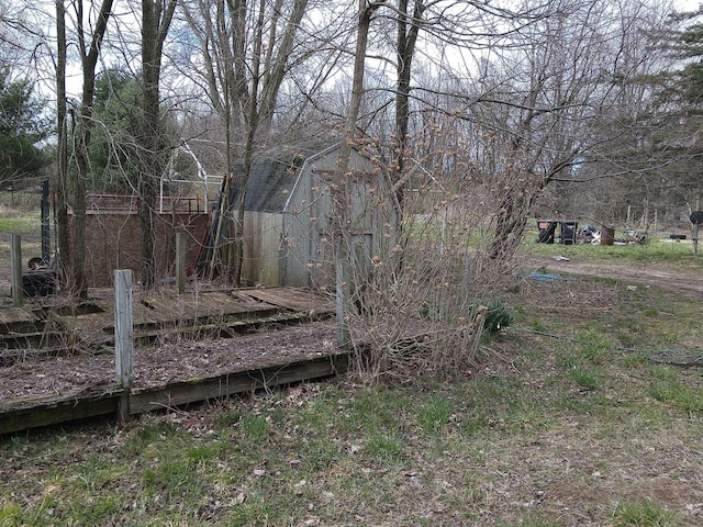 view of yard with a barn and an outbuilding