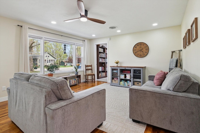 living area featuring visible vents, a ceiling fan, wood finished floors, and recessed lighting
