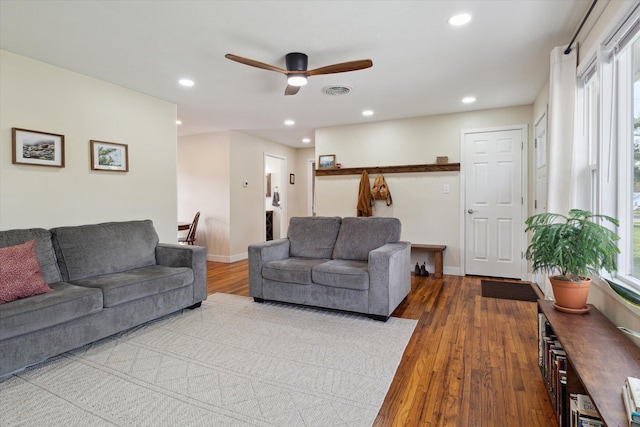 living area featuring a ceiling fan, recessed lighting, and plenty of natural light