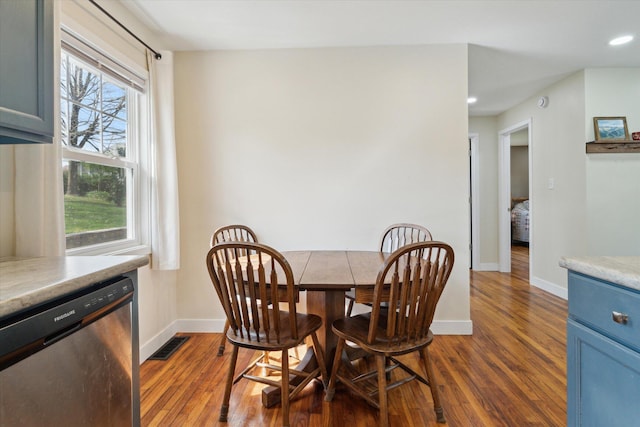 dining room featuring baseboards, visible vents, recessed lighting, and dark wood-type flooring