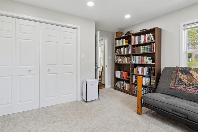 sitting room with recessed lighting and carpet