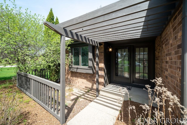 doorway to property with brick siding