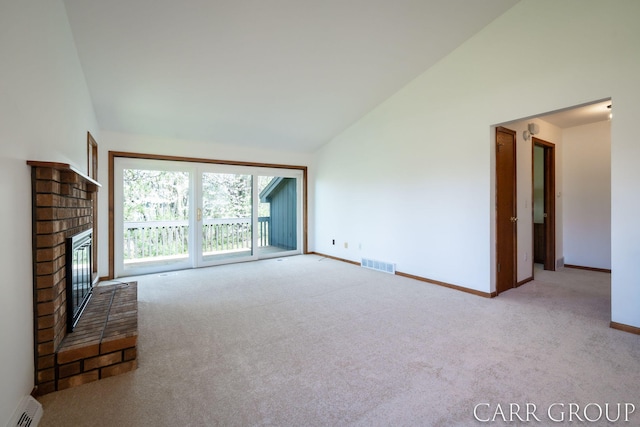 unfurnished living room featuring carpet flooring, baseboards, visible vents, and a brick fireplace