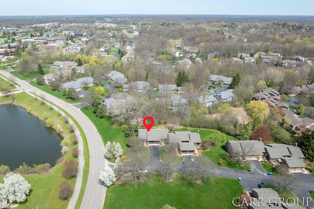 bird's eye view featuring a water view and a residential view