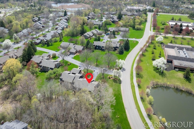 bird's eye view featuring a water view and a residential view