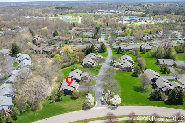 birds eye view of property with a residential view