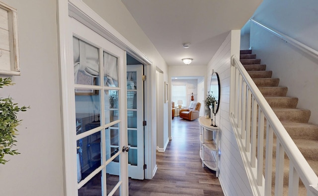 hallway with stairway, baseboards, french doors, and dark wood-style floors