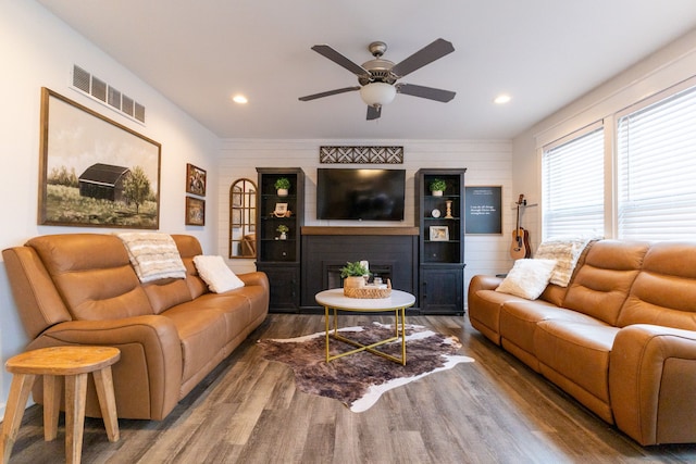 living room featuring ceiling fan, recessed lighting, wood finished floors, and visible vents