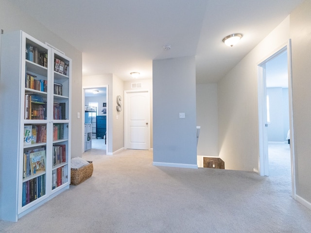 interior space featuring baseboards and visible vents