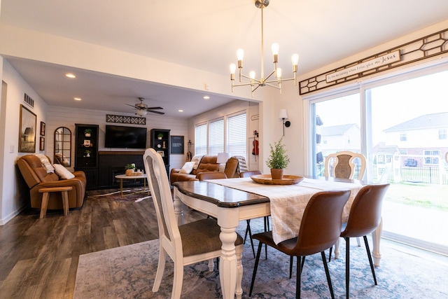 dining area featuring recessed lighting, ceiling fan with notable chandelier, dark wood-style floors, and visible vents