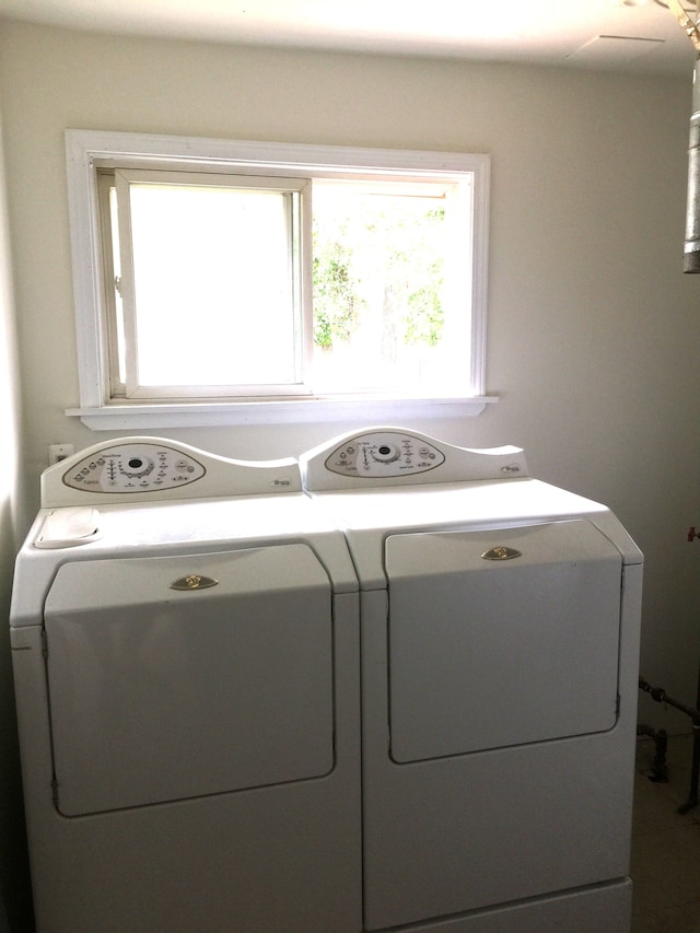 laundry room featuring laundry area and separate washer and dryer
