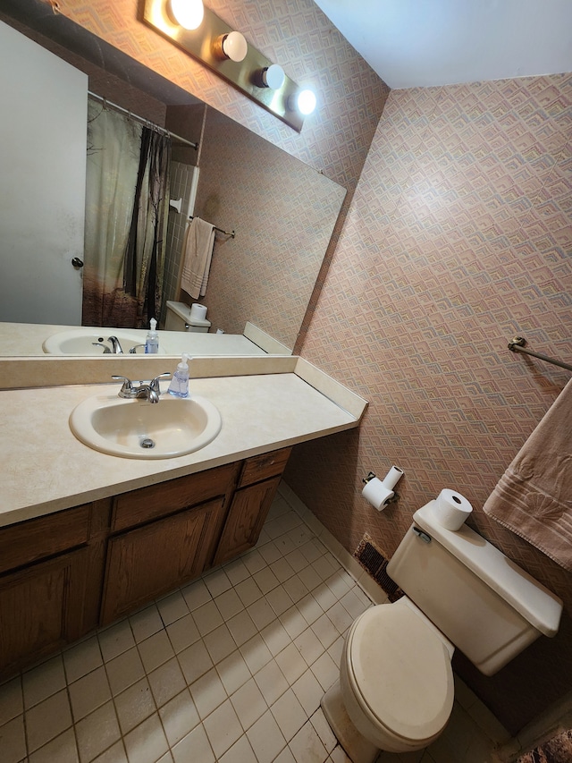bathroom featuring tile patterned floors, vanity, toilet, and a shower with shower curtain