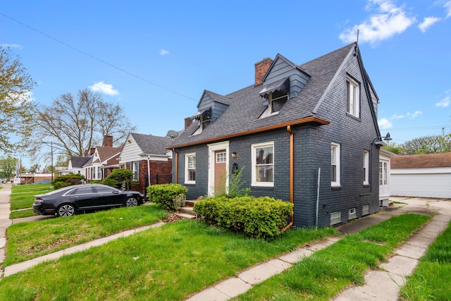 19165 Rutherford St, Detroit, MI 48235 - cape cod-style house featuring a shingled roof, a chimney, a front lawn, and brick siding