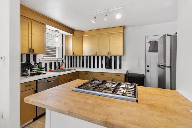 19165 Rutherford St, Detroit, MI 48235 - kitchen featuring light countertops, stainless steel appliances, pendant lighting, and a sink
