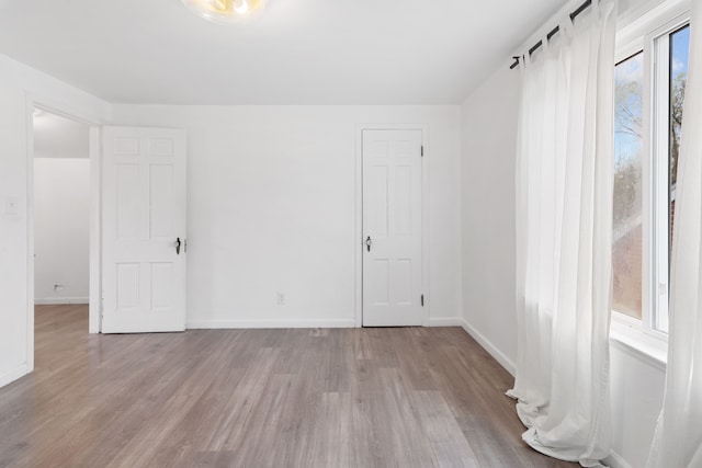 19165 Rutherford St, Detroit, MI 48235 - unfurnished room featuring baseboards and wood finished floors