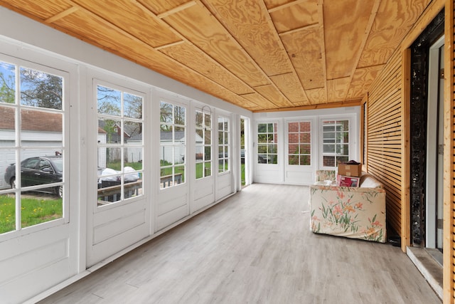 19165 Rutherford St, Detroit, MI 48235 - unfurnished sunroom with wood finished floors, french doors, and wood ceiling