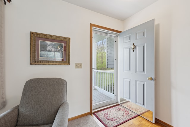 doorway featuring baseboards