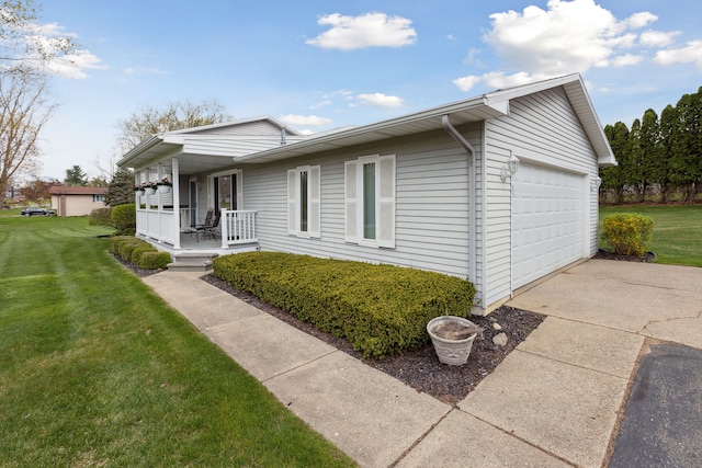 view of front of house featuring a garage, a front lawn, covered porch, and driveway