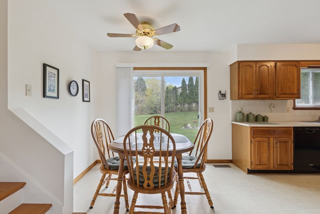 dining area featuring baseboards, a ceiling fan, stairs, and visible vents