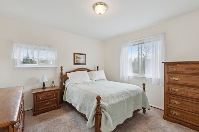bedroom featuring light carpet