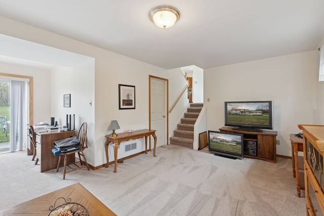 living area with stairway, baseboards, carpet, and visible vents