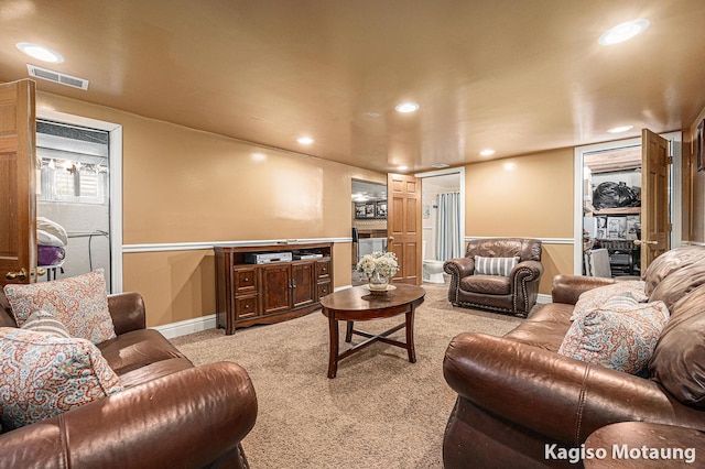 living area featuring baseboards, light carpet, recessed lighting, and visible vents