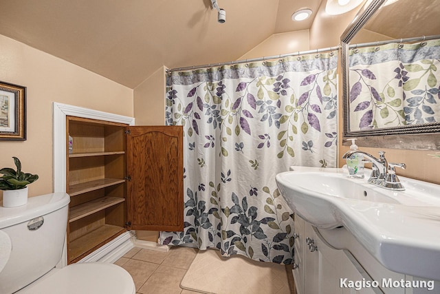 full bath featuring tile patterned flooring, vanity, lofted ceiling, toilet, and a shower with shower curtain