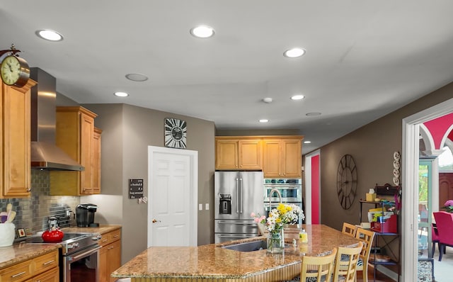 1293 Huntcliff, Milford, MI 48380 - kitchen featuring stainless steel appliances, wall chimney range hood, decorative backsplash, recessed lighting, and light stone countertops