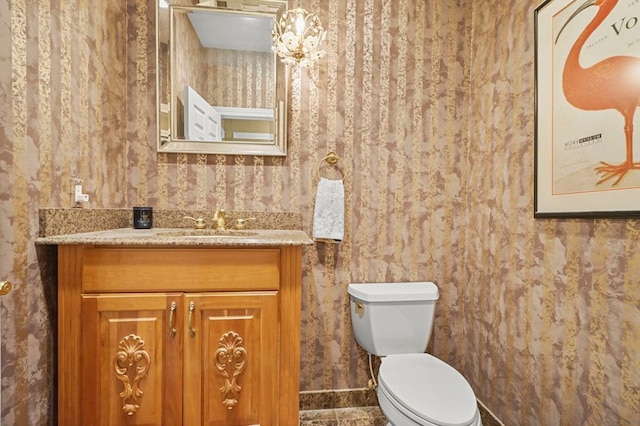 1293 Huntcliff, Milford, MI 48380 - bathroom featuring wallpapered walls, toilet, and vanity