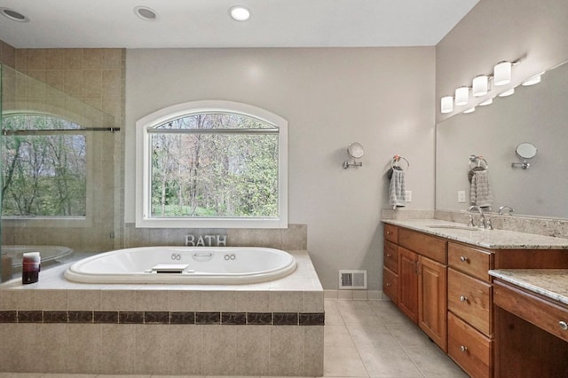 1293 Huntcliff, Milford, MI 48380 - full bathroom with vanity, tile patterned flooring, a bath, and tiled shower