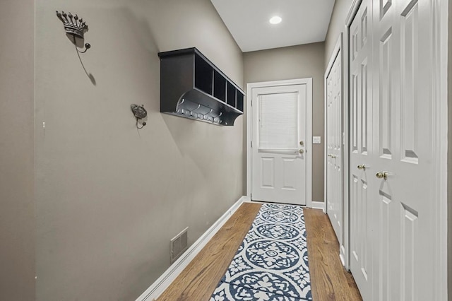 1293 Huntcliff, Milford, MI 48380 - doorway to outside featuring wood finished floors and baseboards