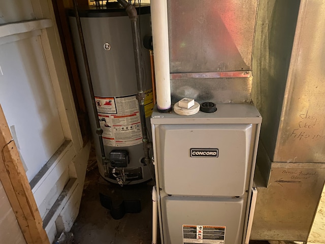 604 E N St, Owosso, MI 48867 - utility room with gas water heater