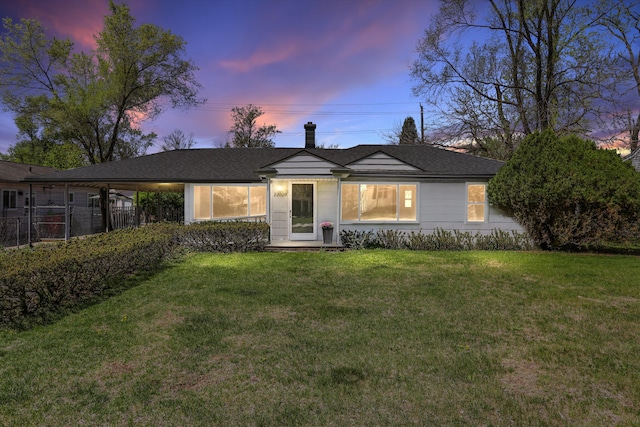 22029 Seminole St, Southfield, MI 48033 - ranch-style home featuring a front lawn, fence, an attached carport, and a chimney
