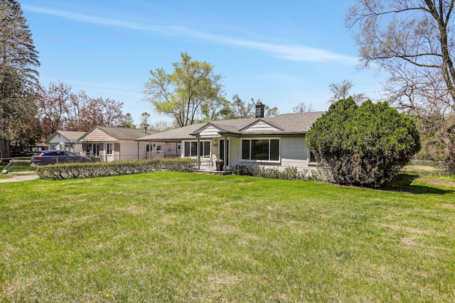 22029 Seminole St, Southfield, MI 48033 - ranch-style home with a shingled roof, a front yard, and a chimney