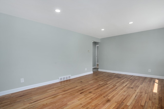 22029 Seminole St, Southfield, MI 48033 - spare room with visible vents, recessed lighting, baseboards, and light wood-type flooring