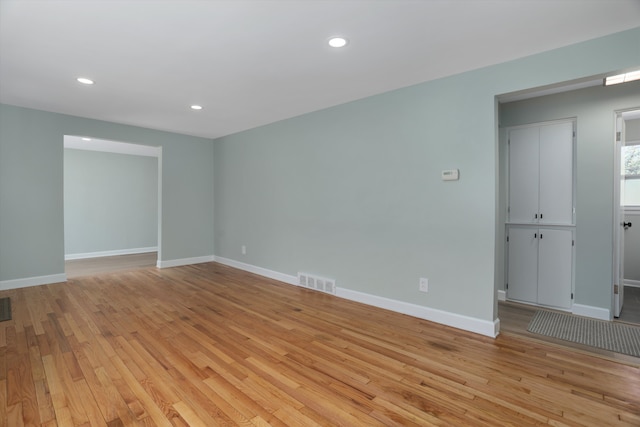 22029 Seminole St, Southfield, MI 48033 - spare room featuring recessed lighting, baseboards, light wood-type flooring, and visible vents