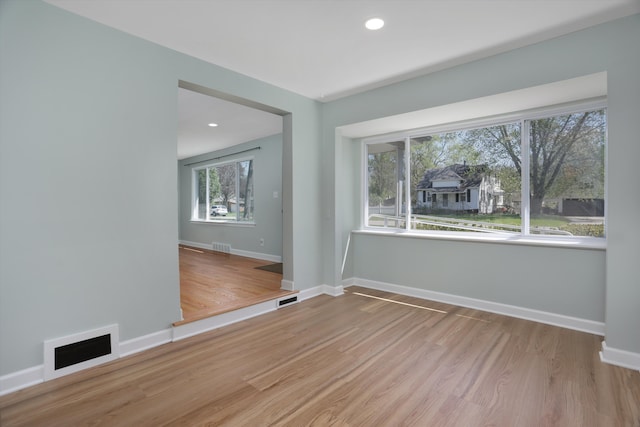22029 Seminole St, Southfield, MI 48033 - spare room with baseboards, visible vents, and wood finished floors
