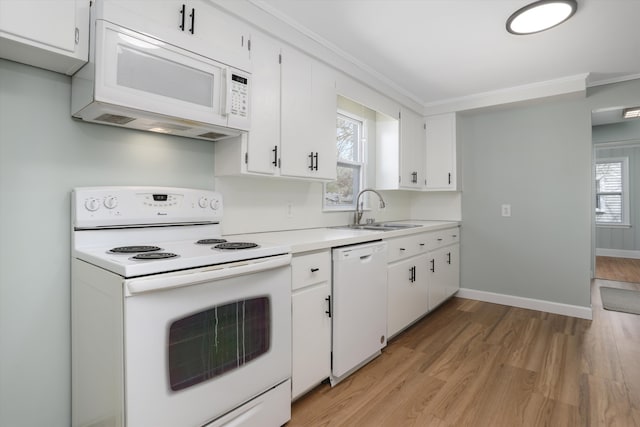 22029 Seminole St, Southfield, MI 48033 - kitchen with a sink, white appliances, light countertops, light wood-style flooring, and white cabinetry