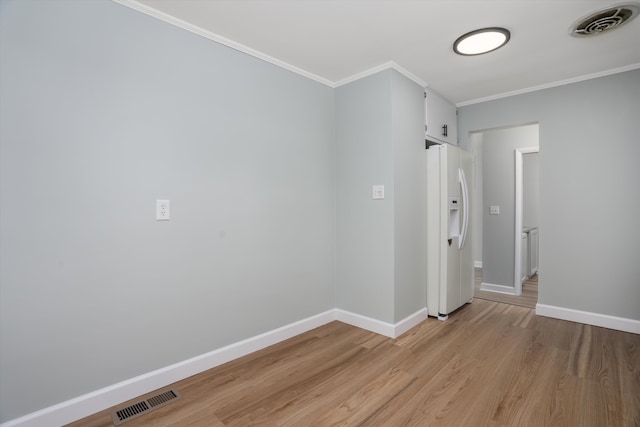 22029 Seminole St, Southfield, MI 48033 - empty room with light wood-style floors, baseboards, crown molding, and visible vents