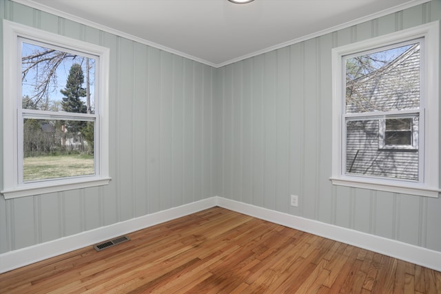 22029 Seminole St, Southfield, MI 48033 - empty room featuring baseboards, visible vents, plenty of natural light, and light wood-style floors