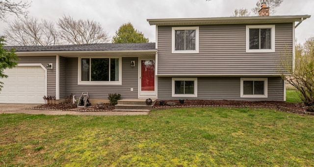 tri-level home with an attached garage, a chimney, and a front yard