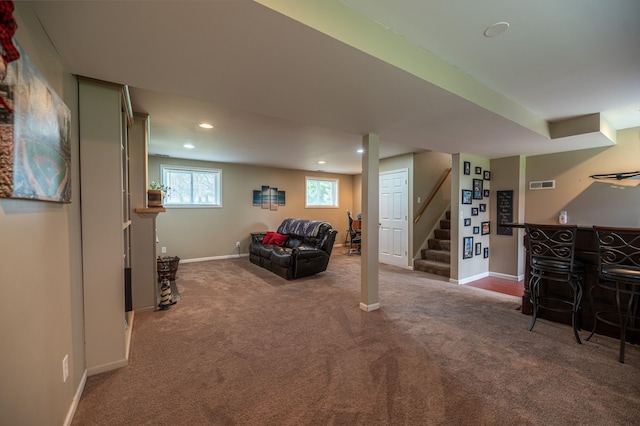 interior space with carpet floors, stairway, baseboards, a dry bar, and recessed lighting