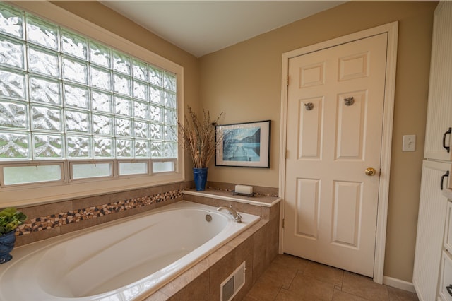 full bath with a garden tub, visible vents, and tile patterned floors