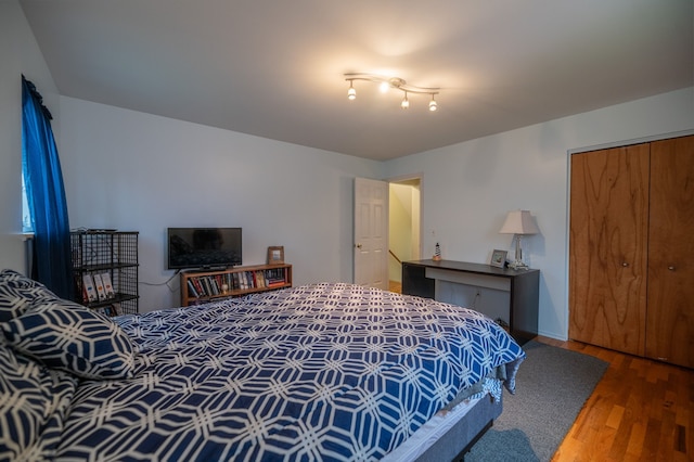 bedroom with a closet and wood finished floors