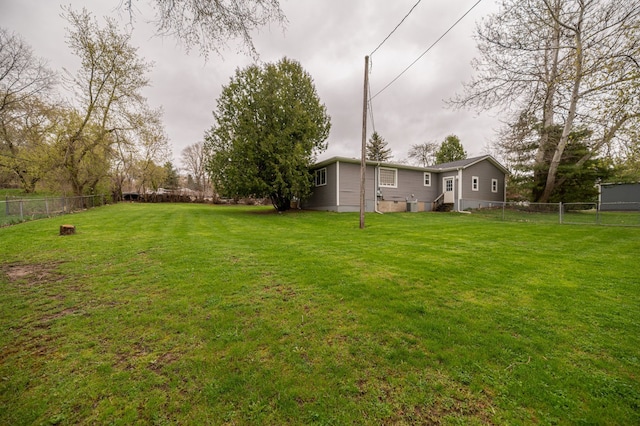 view of yard with a fenced backyard