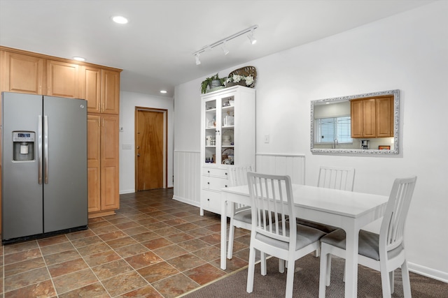 dining space with recessed lighting, baseboards, and stone finish floor